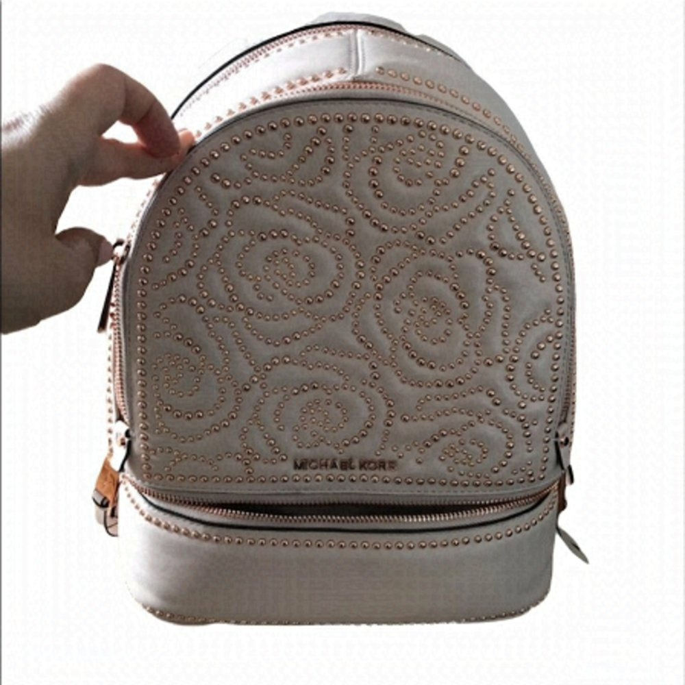 - Michael kors back pack pink with studs